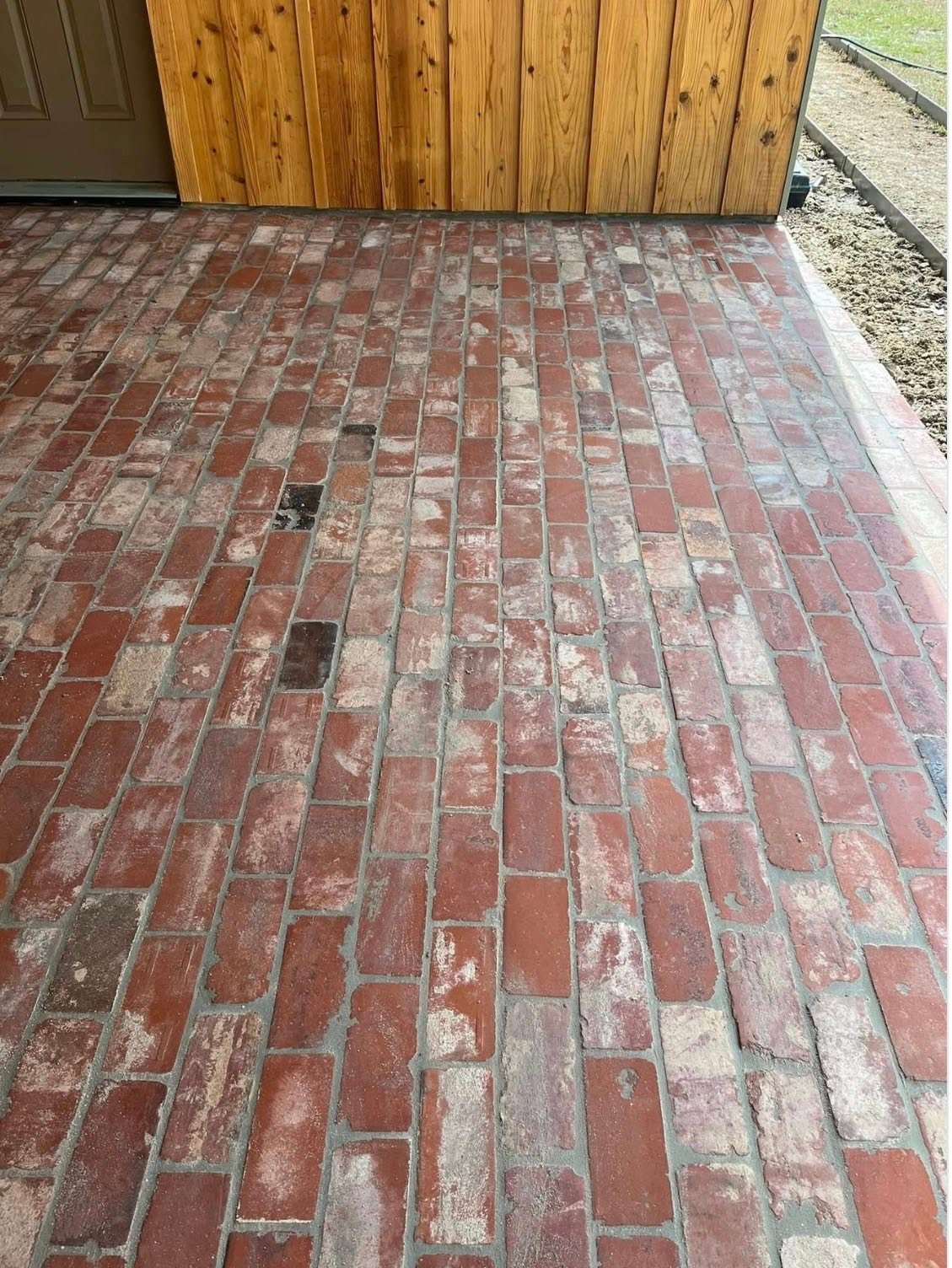 Brick porch flooring installed outside a residential home