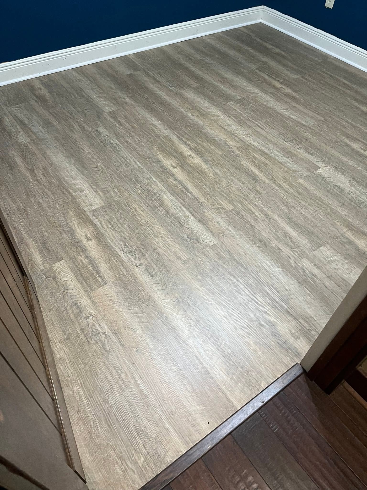Completed gray plank flooring viewed from the doorway